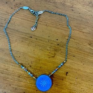 Sabika Sand dollar necklace.